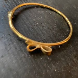 Kate spade gold bangle with bow